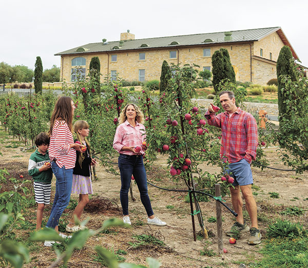Visitors, from left, Alison Luna, with her children Theo and Viva, and Carlyn Shaw enjoy the U-pick area of Gold Ridge Organic Farms with farmer Brooke Hazen. Photo: © 2025 Paige Green